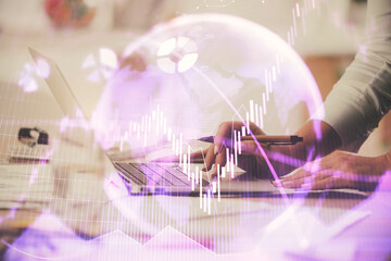 Multi exposure of woman hands typing on computer and financial chart hologram drawing. Stock market analysis concept.