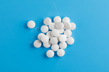 zinc tablets, nutrition supplement pills on blue background