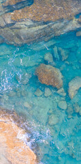 Beach from above in Cyprus with rock formation on the bottom of the sea