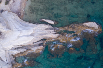 an aerial view of incredible white rock formations on the beachfront in cyprus limassol region