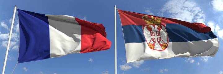 Fototapeta na wymiar Flying flags of France and Serbia on high flagpoles. 3d rendering