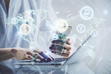 Double exposure of financial graph sketch hologram and woman holding and using a mobile device. Stock exchange concept.