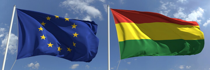 Waving flags of the European Union and Bolivia on flagpoles, 3d rendering
