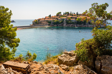 Sveti Stefan luxury resort. View to Sveti Stefan island in Adriatic sea from footpath.