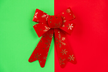 red bow on green and red background.
