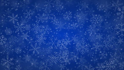 Christmas background of snowflakes of different shapes, sizes and transparency in blue colors