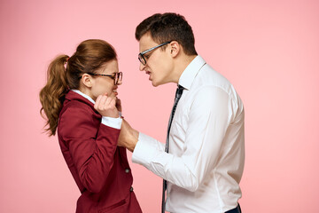 business man and woman office work colleagues team office management studio pink background