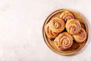 Baked cinnamon buns served with cinnamon