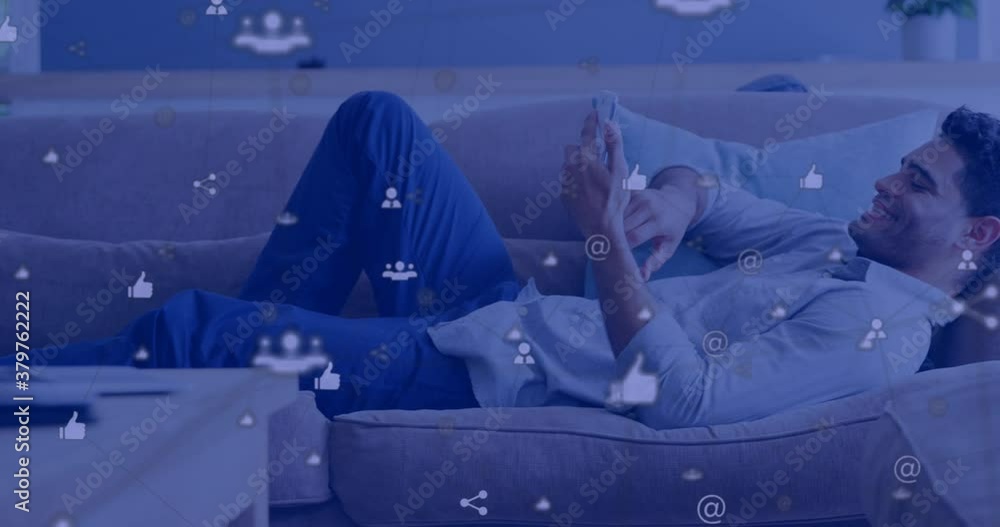 Poster multiple digital icons against man using smartphone while laying on the couch
