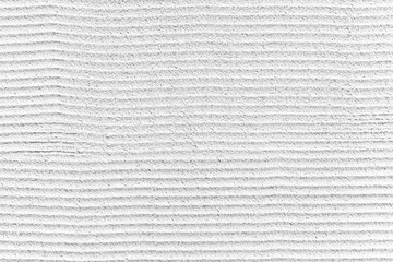 Rough patterned white cement wall texture and seamless background