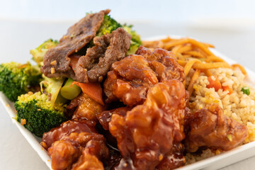 Ordering restaurant food for some good mixed plate with mongolian beef, rice, broccoli, and orange chicken.