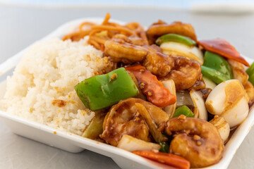Ordering restaurant food for some good rice and spicy garlic shrimp with vegetables.