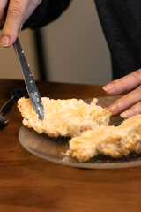 Elderly woman preparing baked and enjoying goods