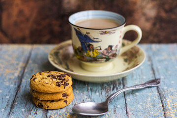 Hot milk coffee with abstract background and cookies