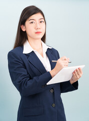 Teenage girl in suit using computer digital tablet