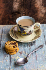 Hot milk coffee with abstract background and cookies