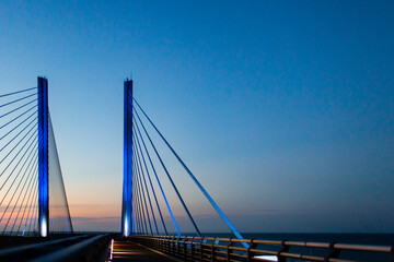 steel bridge over waterway evening sky