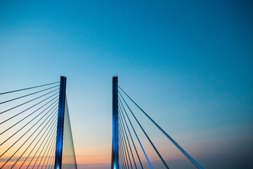 steel bridge over waterway evening sky