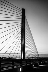 steel bridge over waterway evening sky