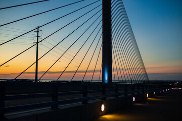 Obraz premium steel bridge over waterway evening sky
