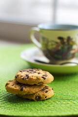 Hot milk coffee with abstract background and cookies