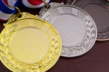 Gold, silver and bronze medal close up