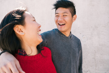 Asian couple having good time together.