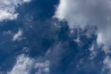 Fototapeta na wymiar Dark blue sky and white clouds, heavens, daylight