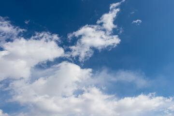 Bright blue sky and fluffy white clouds, wallpaper