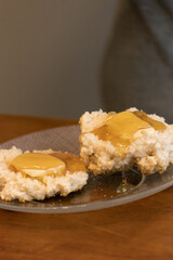 Elderly woman preparing baked and enjoying goods