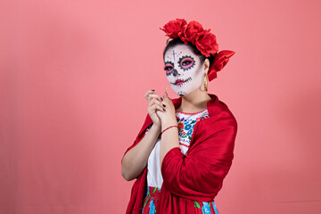 A young woman disguised as a catrina