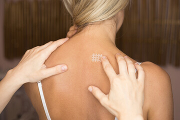 Kinesiotaping, kinesiology tape - application for back pain