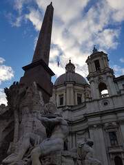 Fototapeta na wymiar Sant'Agnese in Agone. Piazza Navona. Church and fountain in a historic plaza in Rome. Italy
