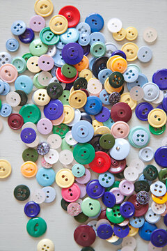 close up of a collection of happy and colourful buttons