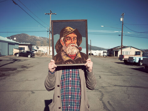Man Standing In Street With Sailor Art