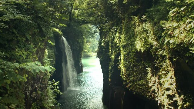 Takachiho gorge Miyazaki Japan, 4K slow motion waterfall sacred tranquil spiritual.