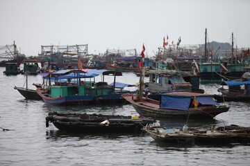 Fototapeta na wymiar Floating Fishing Village In The Ha Long Bay. Cat Ba Island, Vietnam Asia. Cat Ba, Vietnam - March 5, 2020