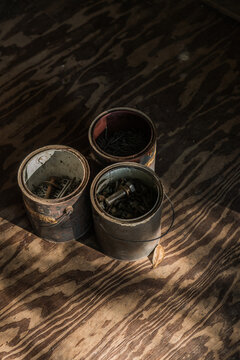 Old Vintage Paint Cans with collections of Harware and Nails