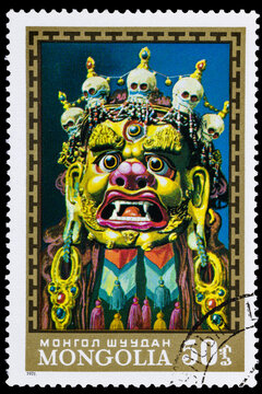 The postage stamp printed by Mongolia, shows Traditional ritual mask of three-eyed God Dordjalam, circa 1971. Macro photography. Complete clipping.