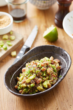 Close-up of served healthy tartare made with red tuna,avocado,lime and soy sauce