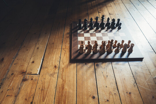 Wooden chess board on parquet
