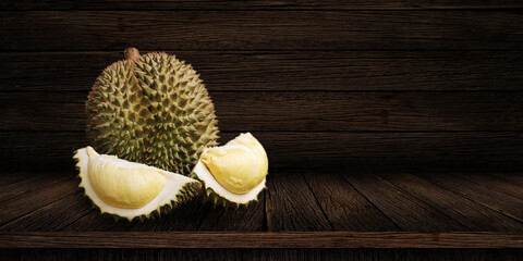 Durian riped and fresh, Durian peel with yellow color on old wood background. king of fruit from...