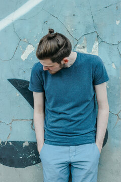 Portrait of a young male model on the street