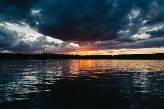 Dramatic clouds during sunset on Minnesota Lake.