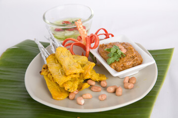 Grill pork satay moo satay Grilled pork served with bean sauce and pickle cucumbers and onions in vinegar Thai street food on the white background