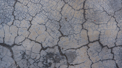 Cracked concrete texture with splash of paint