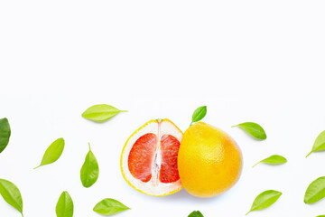 High vitamin C. Juicy grapefruit with leaves on white background.