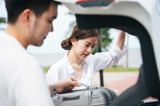 Asian Couple Prepare For A Roadtrip.