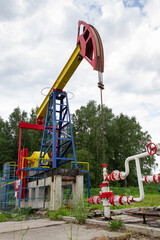 Fototapeta na wymiar oil pump raised high against the sky