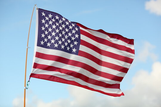 US flag waving on the beach